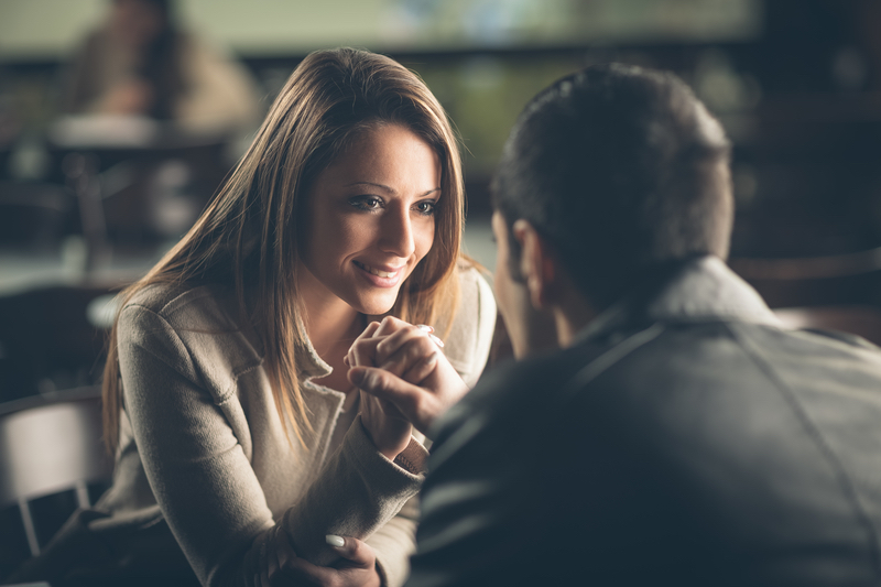 Romantic couple flirting at the bar_small