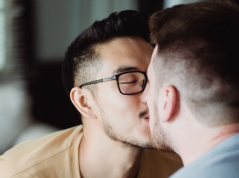 Man becoming a better lover and kissing another man