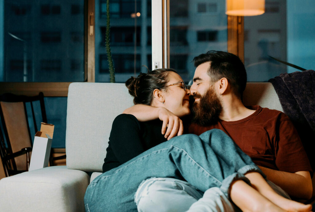 Loving couple touching faces, while discussing boundaries for core desires.
