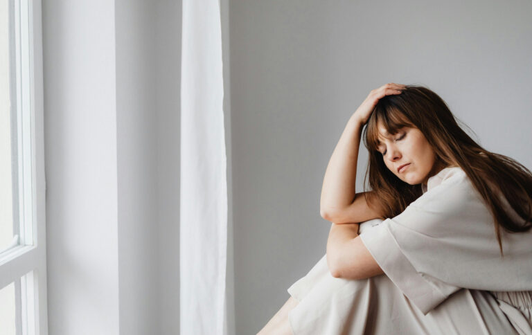 Woman contemplating her core wounds and core protective strategies