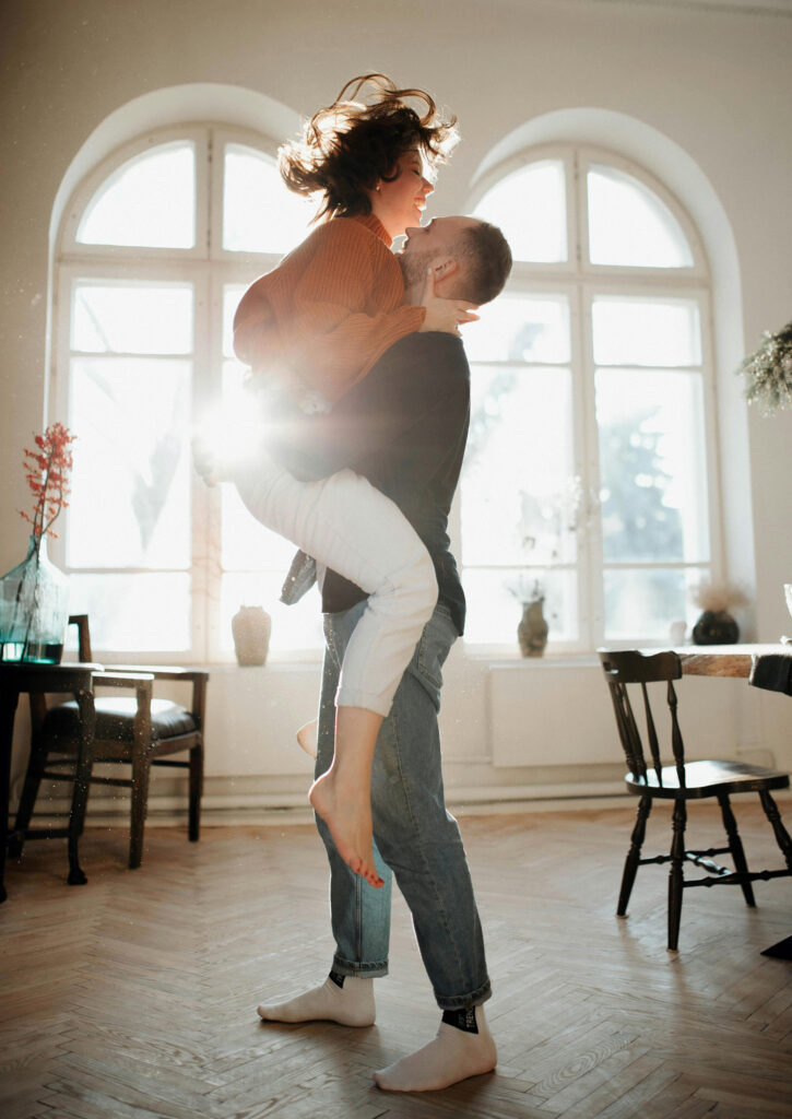 Couple engaged in a primal, somatic play exercise